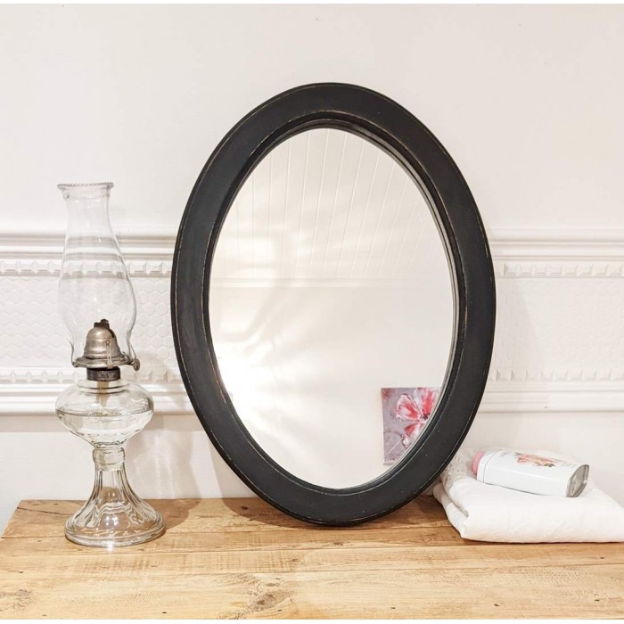 Miroir ovale bois noir antiqué